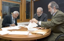 K.R. Sreenivasan and Jafar Towfighi Darian (centre) signing the agreement